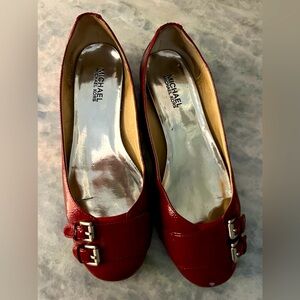 Authentic Michael Kors flats red with silver buckles size 8.5 great condition..
